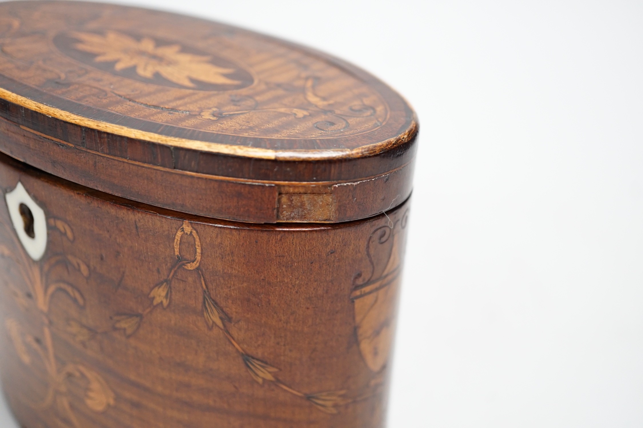 A George III oval harewood and marquetry tea caddy, c.1790, 12cms high x 15cms wide